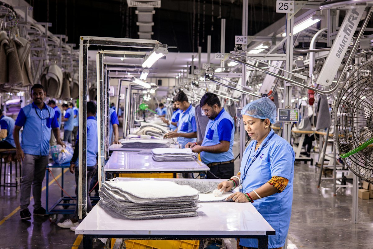 Workers at a busy garment factory floor