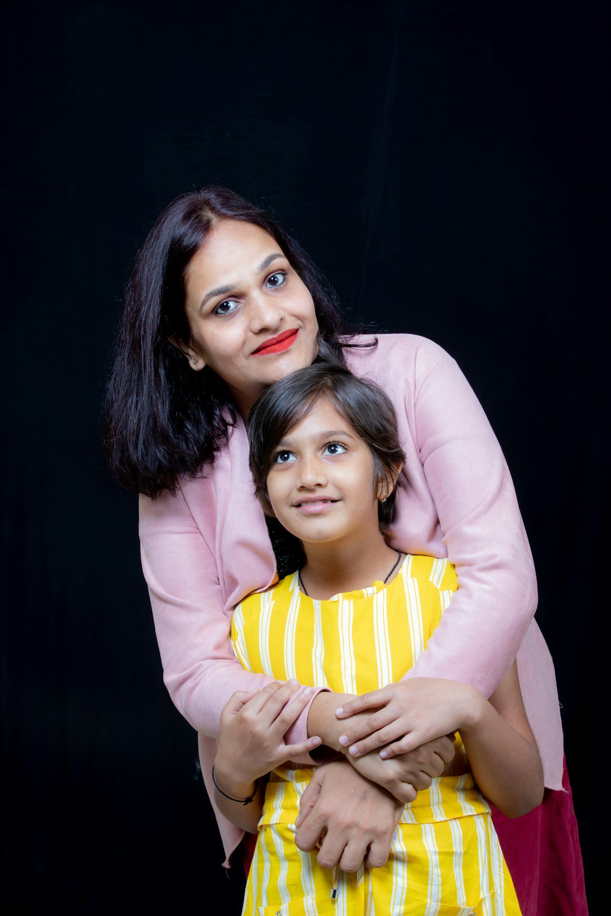 A mother smiling with her daughter