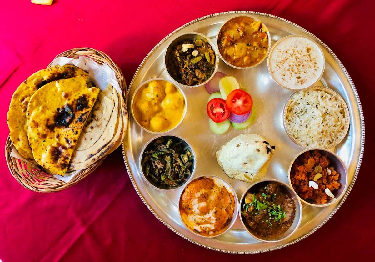 A colourful Indian thali with roti and many small bowls
